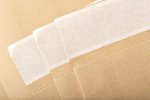 Paper bag with adhesive strip Paper bag